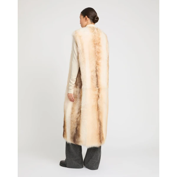 Woman wearing Yves Salomon shearling fur coat – luxury outerwear at Luxury Shoes 