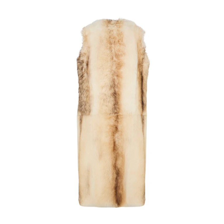 Woman wearing Yves Salomon shearling fur coat – luxury outerwear at Luxury Shoes 
