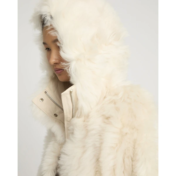 Woman wearing Yves Salomon shearling fur coat – luxury outerwear at Luxury Shoes 
