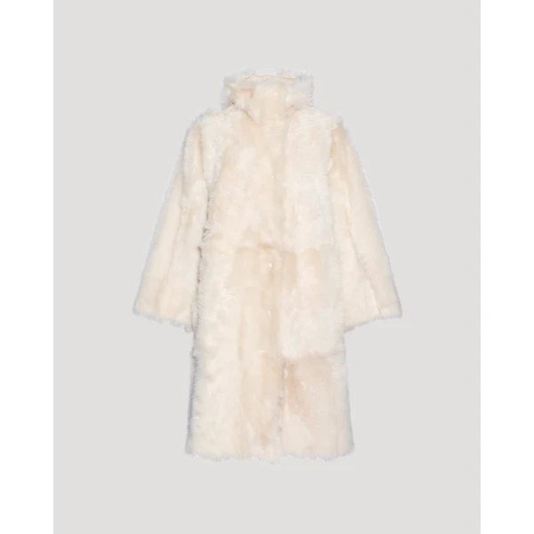 Woman wearing Yves Salomon shearling fur coat – luxury outerwear at Luxury Shoes 