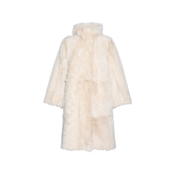 Woman wearing Yves Salomon shearling fur coat – luxury outerwear at Luxury Shoes 