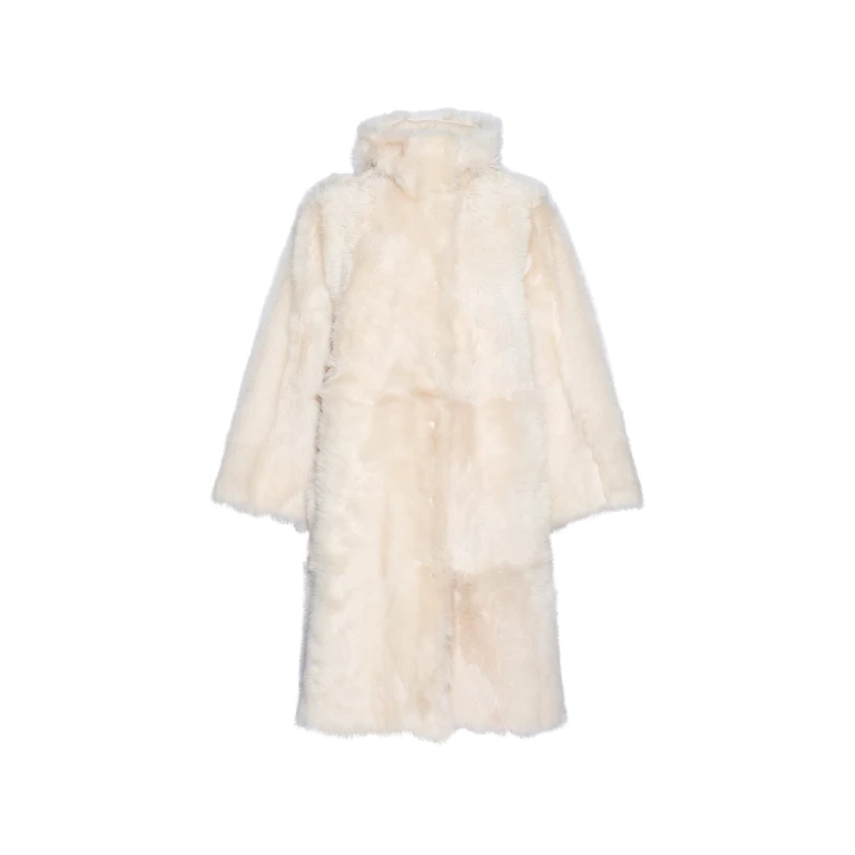Woman wearing Yves Salomon shearling fur coat – luxury outerwear at Luxury Shoes 