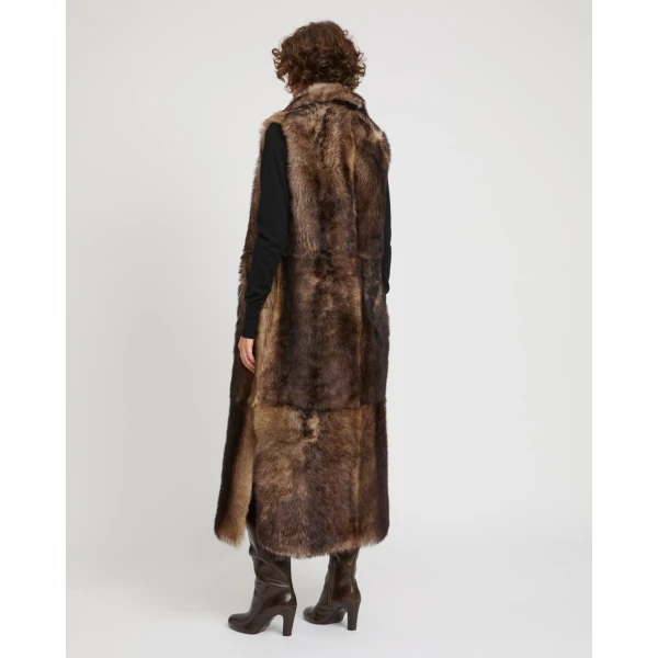 Woman wearing Yves Salomon shearling fur coat – luxury outerwear at Luxury Shoes 
