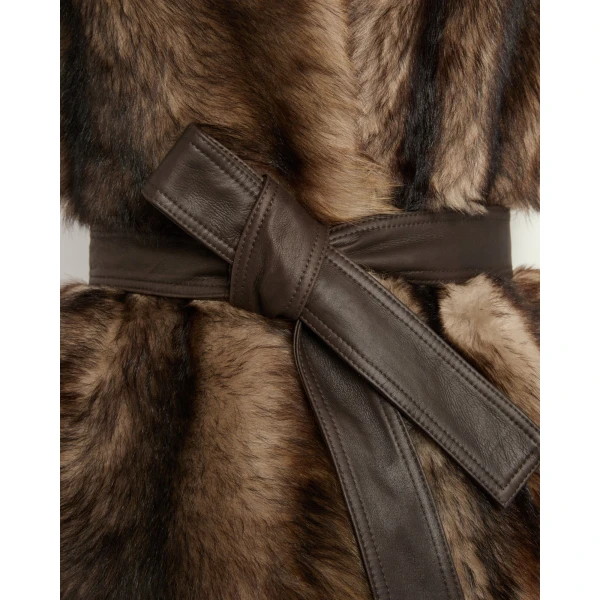 Woman wearing Yves Salomon shearling fur coat – luxury outerwear at Luxury Shoes 