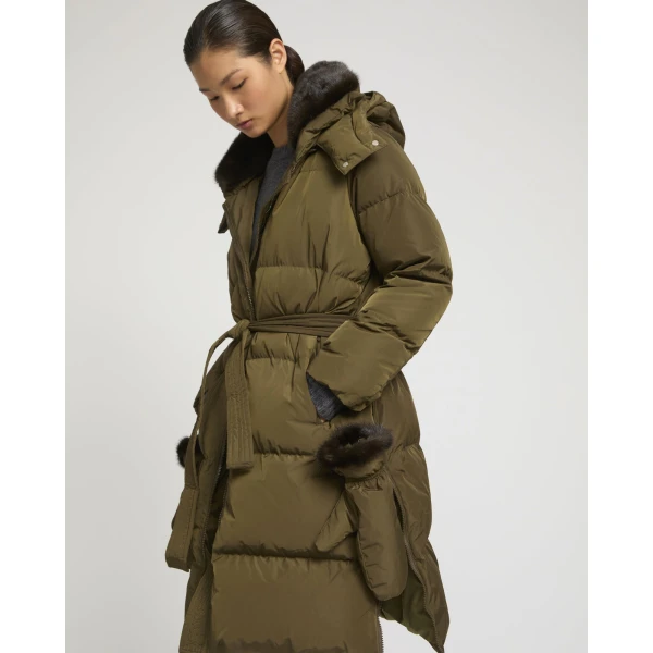 Woman wearing Yves Salomon shearling fur coat – luxury outerwear at Luxury Shoes 
