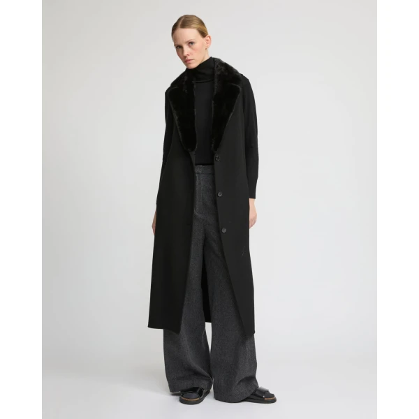 Woman wearing Yves Salomon shearling fur coat – luxury outerwear at Luxury Shoes 