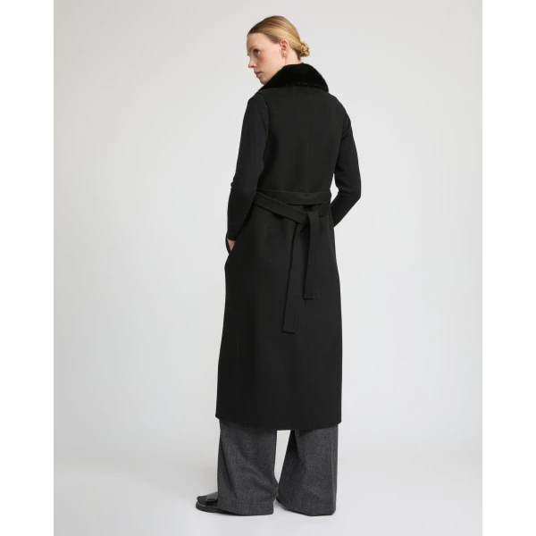 Woman wearing Yves Salomon shearling fur coat – luxury outerwear at Luxury Shoes 