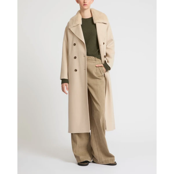 Woman wearing Yves Salomon shearling fur coat – luxury outerwear at Luxury Shoes 