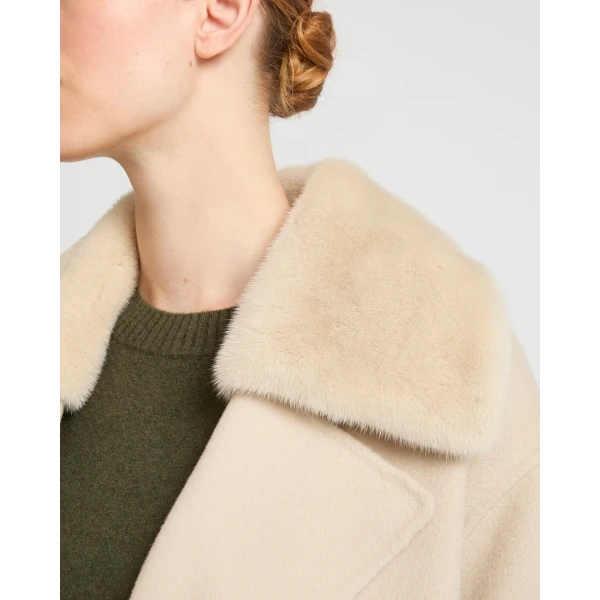 Woman wearing Yves Salomon shearling fur coat – luxury outerwear at Luxury Shoes 