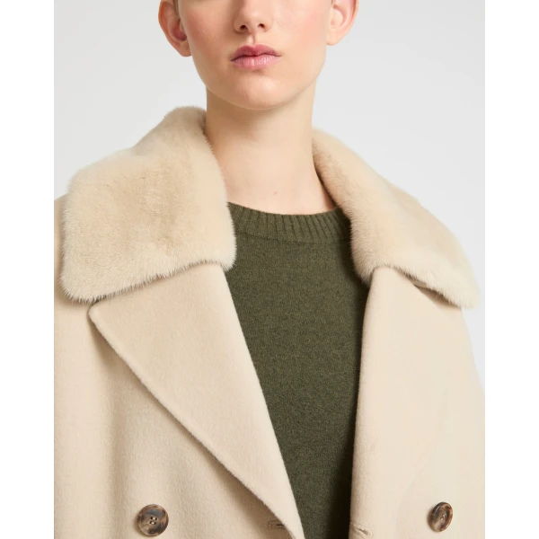 Woman wearing Yves Salomon shearling fur coat – luxury outerwear at Luxury Shoes 