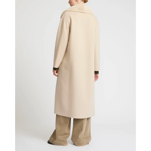 Woman wearing Yves Salomon shearling fur coat – luxury outerwear at Luxury Shoes 