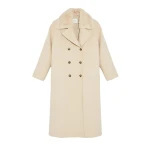 Woman wearing Yves Salomon shearling fur coat – luxury outerwear at Luxury Shoes 