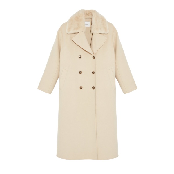 Woman wearing Yves Salomon shearling fur coat – luxury outerwear at Luxury Shoes 