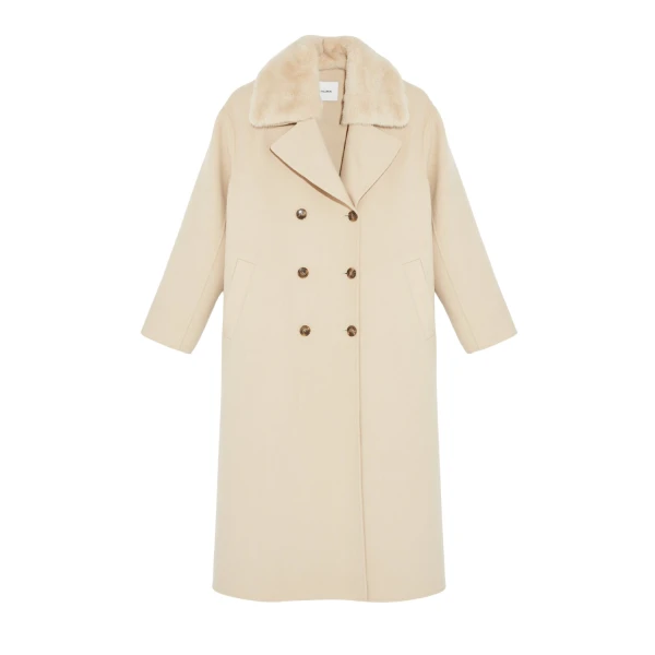 Woman wearing Yves Salomon shearling fur coat – luxury outerwear at Luxury Shoes 