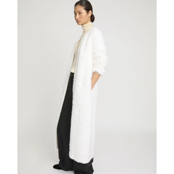 Woman wearing Yves Salomon shearling fur coat – luxury outerwear at Luxury Shoes 