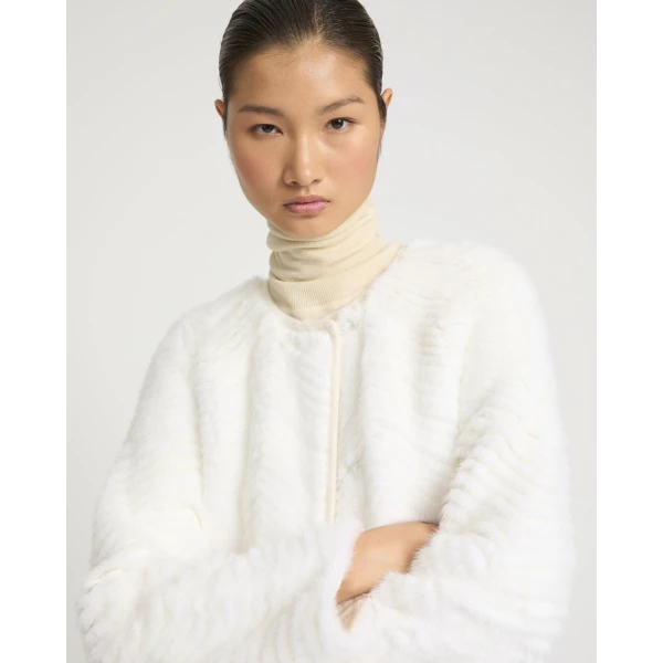 Woman wearing Yves Salomon shearling fur coat – luxury outerwear at Luxury Shoes 