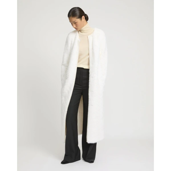 Woman wearing Yves Salomon shearling fur coat – luxury outerwear at Luxury Shoes 