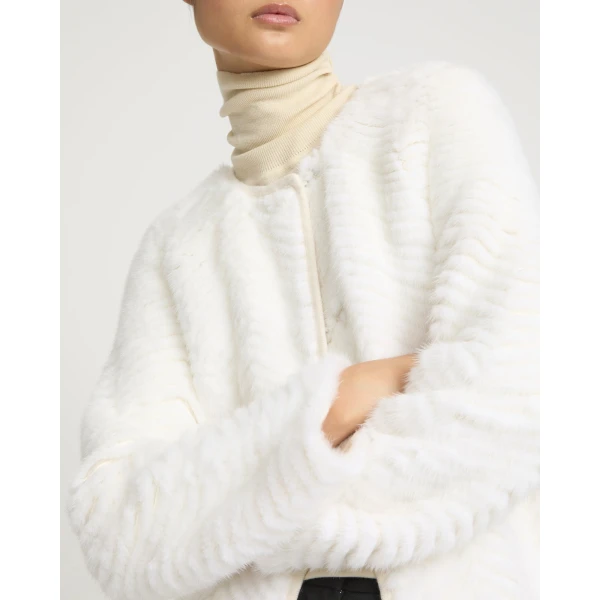 Woman wearing Yves Salomon shearling fur coat – luxury outerwear at Luxury Shoes 