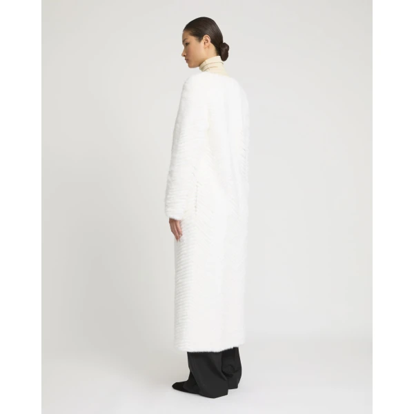 Woman wearing Yves Salomon shearling fur coat – luxury outerwear at Luxury Shoes 