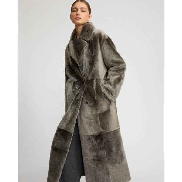 Woman wearing Yves Salomon shearling fur coat – luxury outerwear at Luxury Shoes 