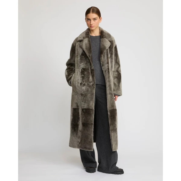 Woman wearing Yves Salomon shearling fur coat – luxury outerwear at Luxury Shoes 