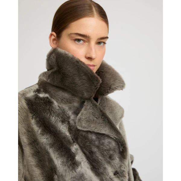 Woman wearing Yves Salomon shearling fur coat – luxury outerwear at Luxury Shoes 