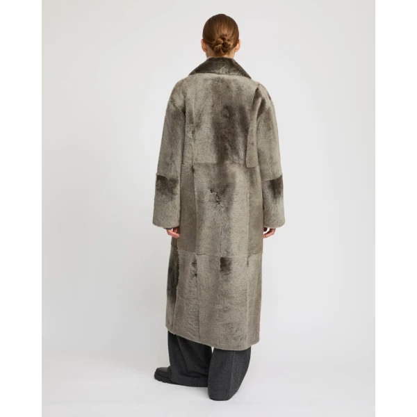 Woman wearing Yves Salomon shearling fur coat – luxury outerwear at Luxury Shoes 