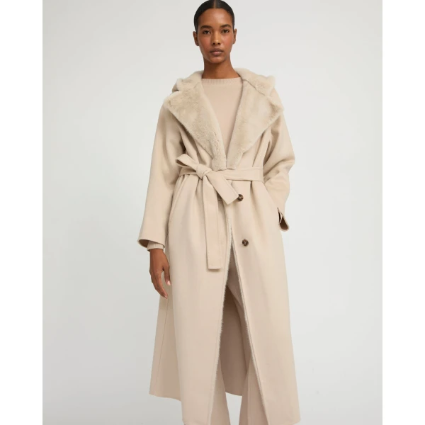 Woman wearing Yves Salomon shearling fur coat – luxury outerwear at Luxury Shoes 