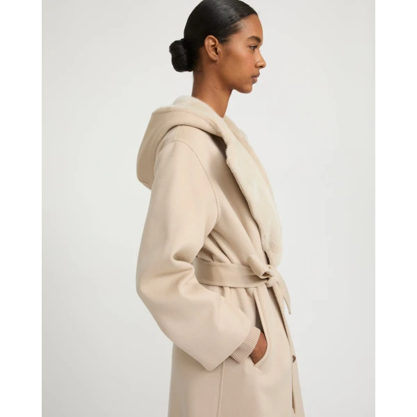 Woman wearing Yves Salomon shearling fur coat – luxury outerwear at Luxury Shoes 