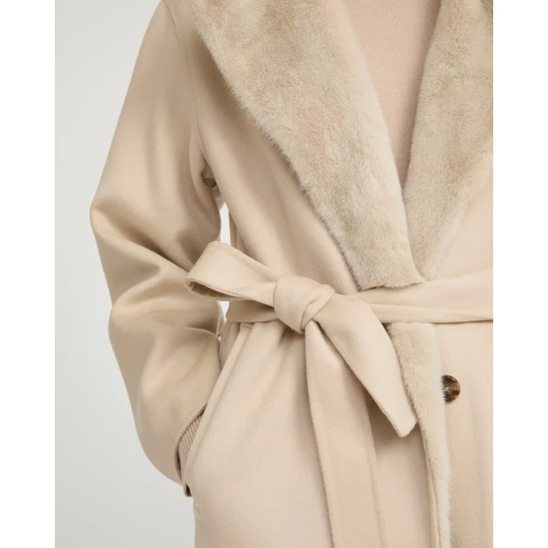 Woman wearing Yves Salomon shearling fur coat – luxury outerwear at Luxury Shoes 