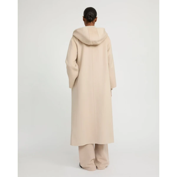 Woman wearing Yves Salomon shearling fur coat – luxury outerwear at Luxury Shoes 