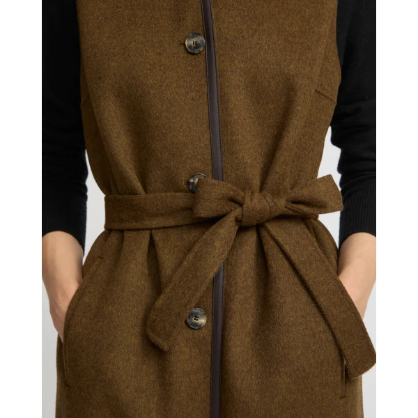 Woman wearing Yves Salomon shearling fur coat – luxury outerwear at Luxury Shoes 
