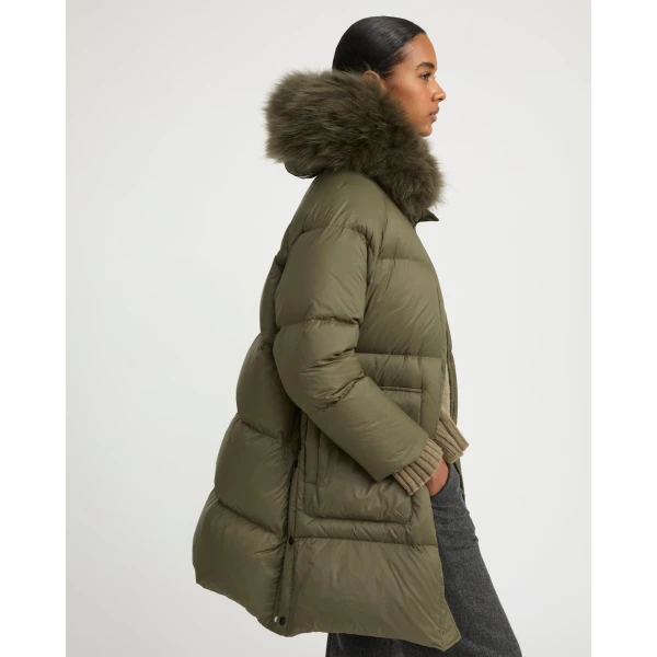 Woman wearing Yves Salomon shearling fur coat – luxury outerwear at Luxury Shoes 