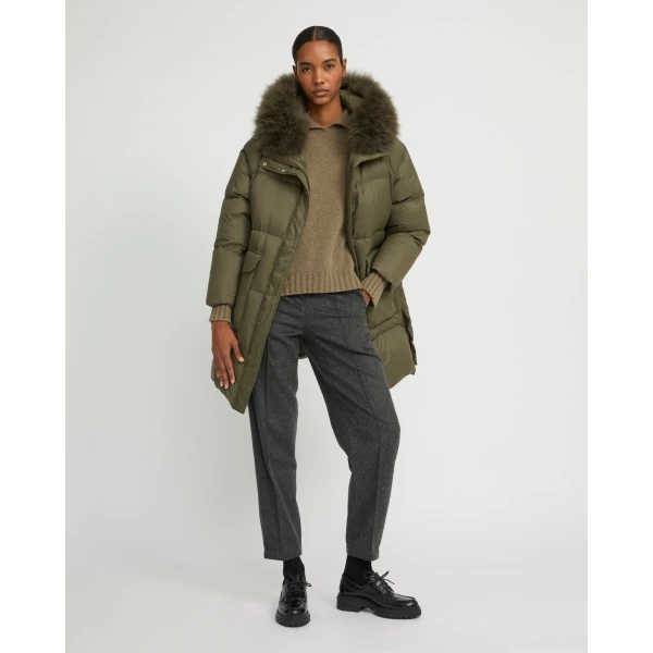 Woman wearing Yves Salomon shearling fur coat – luxury outerwear at Luxury Shoes 