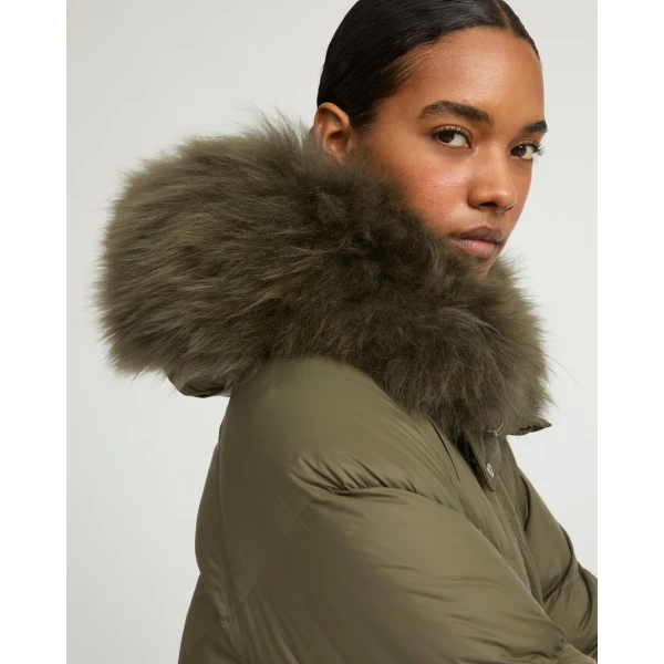 Woman wearing Yves Salomon shearling fur coat – luxury outerwear at Luxury Shoes 