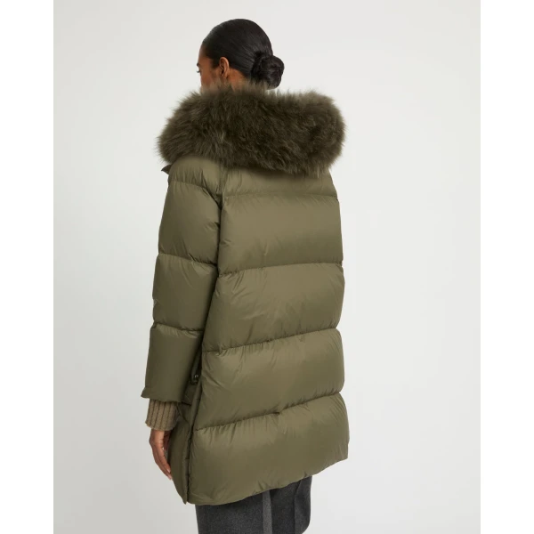 Woman wearing Yves Salomon shearling fur coat – luxury outerwear at Luxury Shoes 