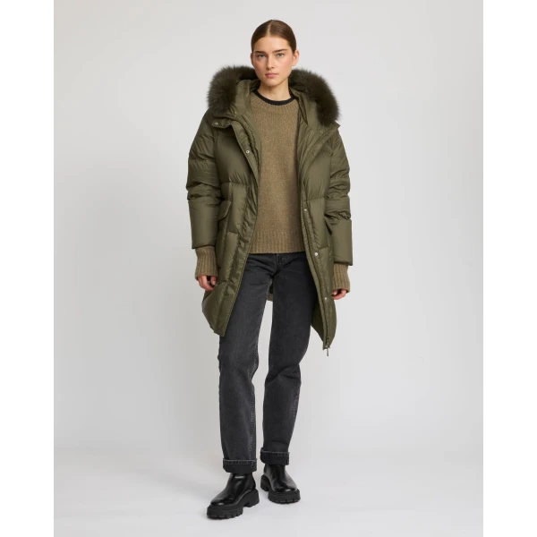 Woman wearing Yves Salomon shearling fur coat – luxury outerwear at Luxury Shoes 