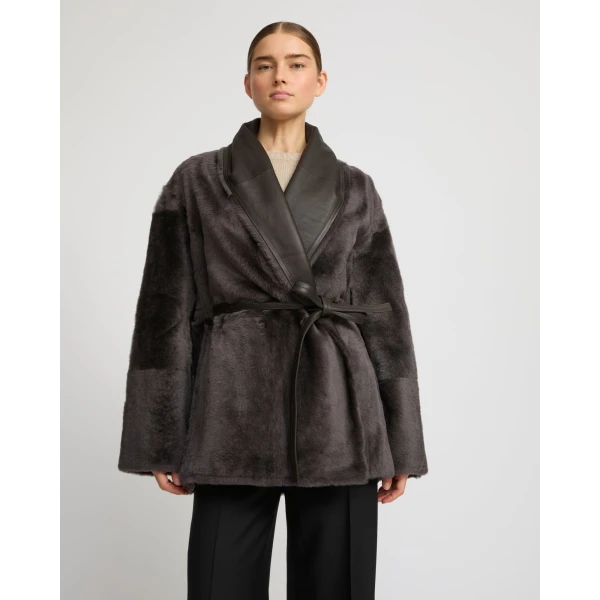Woman wearing Yves Salomon shearling fur coat – luxury outerwear at Luxury Shoes 