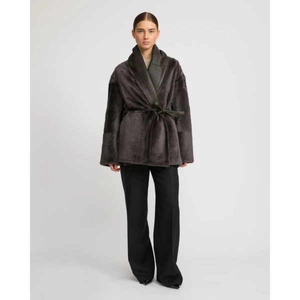 Woman wearing Yves Salomon shearling fur coat – luxury outerwear at Luxury Shoes 