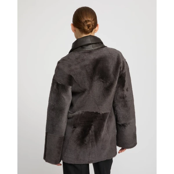 Woman wearing Yves Salomon shearling fur coat – luxury outerwear at Luxury Shoes 