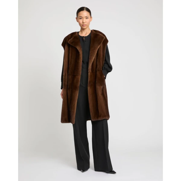 Woman wearing Yves Salomon shearling fur coat – luxury outerwear at Luxury Shoes 
