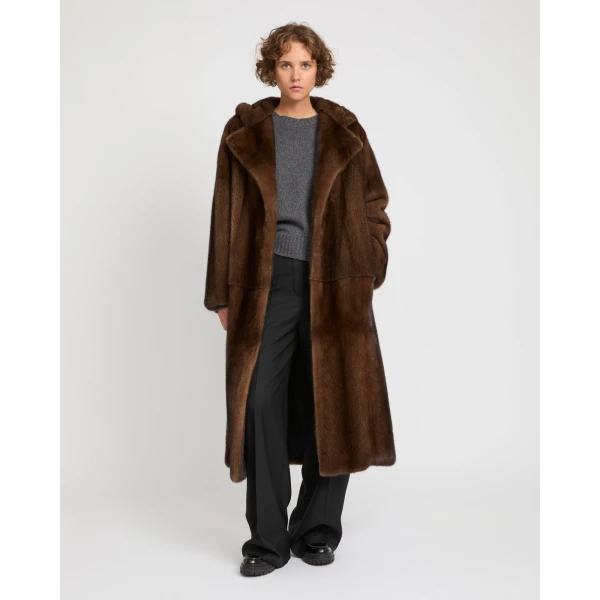 Woman wearing Yves Salomon shearling fur coat – luxury outerwear at Luxury Shoes 