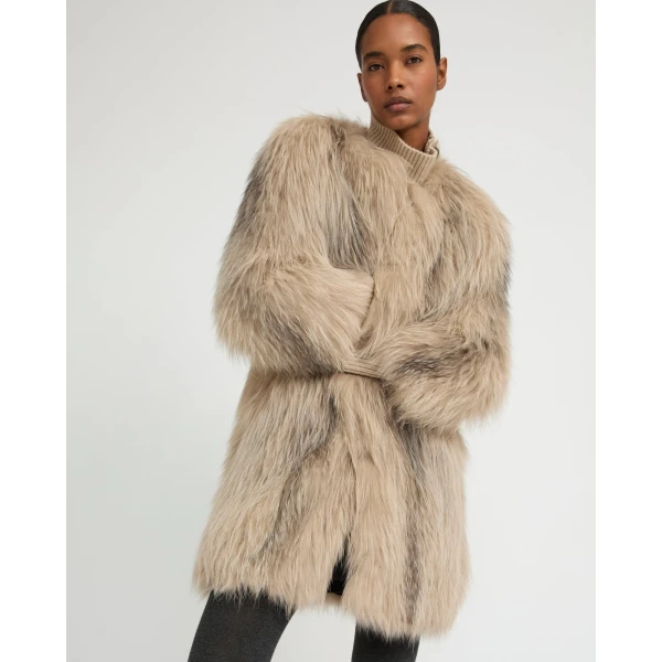 Woman wearing Yves Salomon shearling fur coat – luxury outerwear at Luxury Shoes 