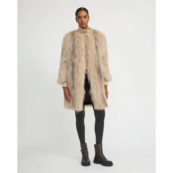 Woman wearing Yves Salomon shearling fur coat – luxury outerwear at Luxury Shoes 