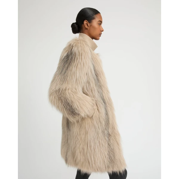 Woman wearing Yves Salomon shearling fur coat – luxury outerwear at Luxury Shoes 