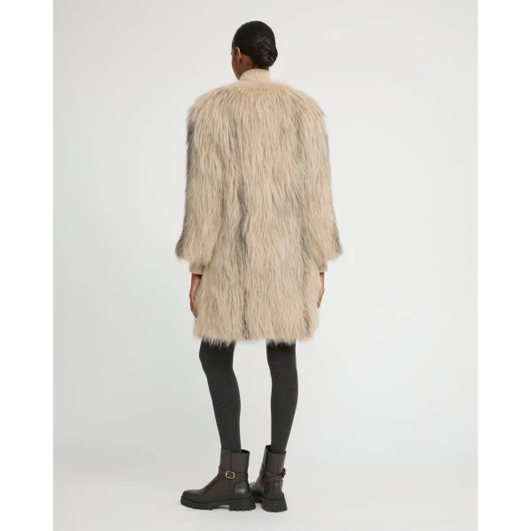 Woman wearing Yves Salomon shearling fur coat – luxury outerwear at Luxury Shoes 