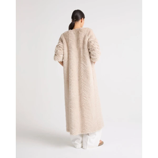 Woman wearing Yves Salomon shearling fur coat – luxury outerwear at Luxury Shoes 
