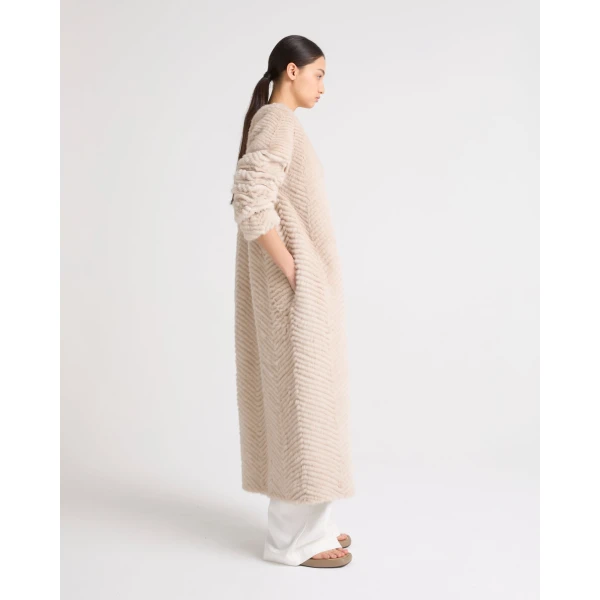 Woman wearing Yves Salomon shearling fur coat – luxury outerwear at Luxury Shoes 