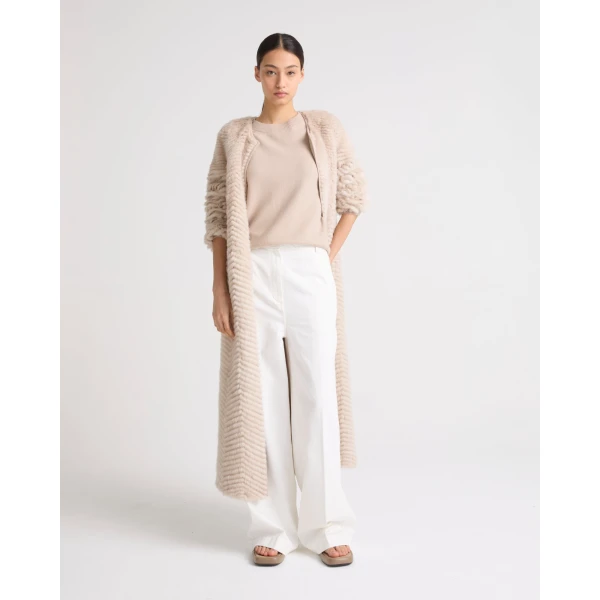 Woman wearing Yves Salomon shearling fur coat – luxury outerwear at Luxury Shoes 