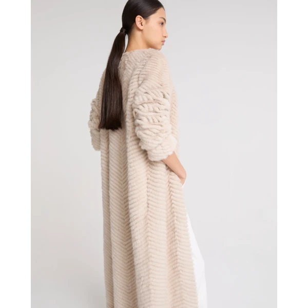 Woman wearing Yves Salomon shearling fur coat – luxury outerwear at Luxury Shoes 